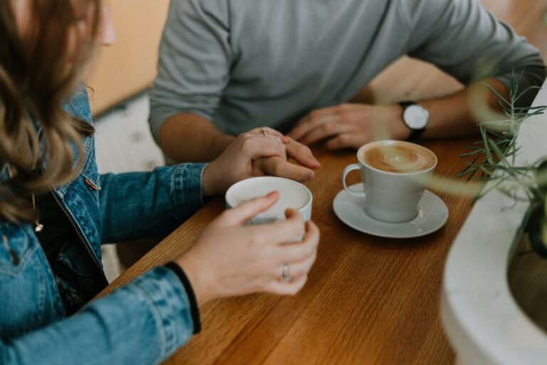 Two mugs on a cafe table, a quiet invitation to talk