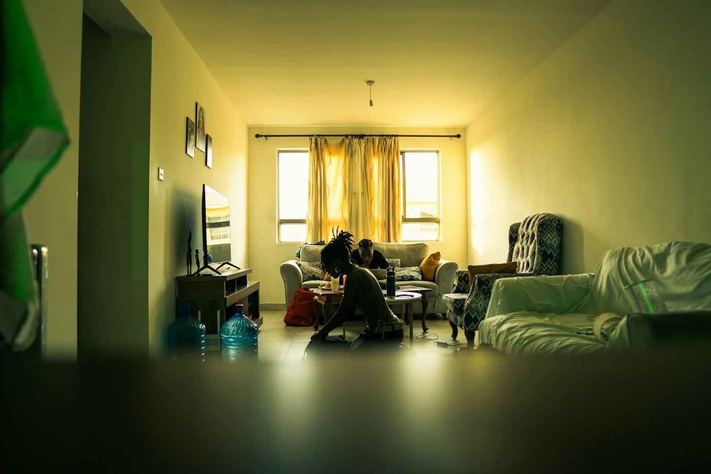 People talking in a warmly lit living room