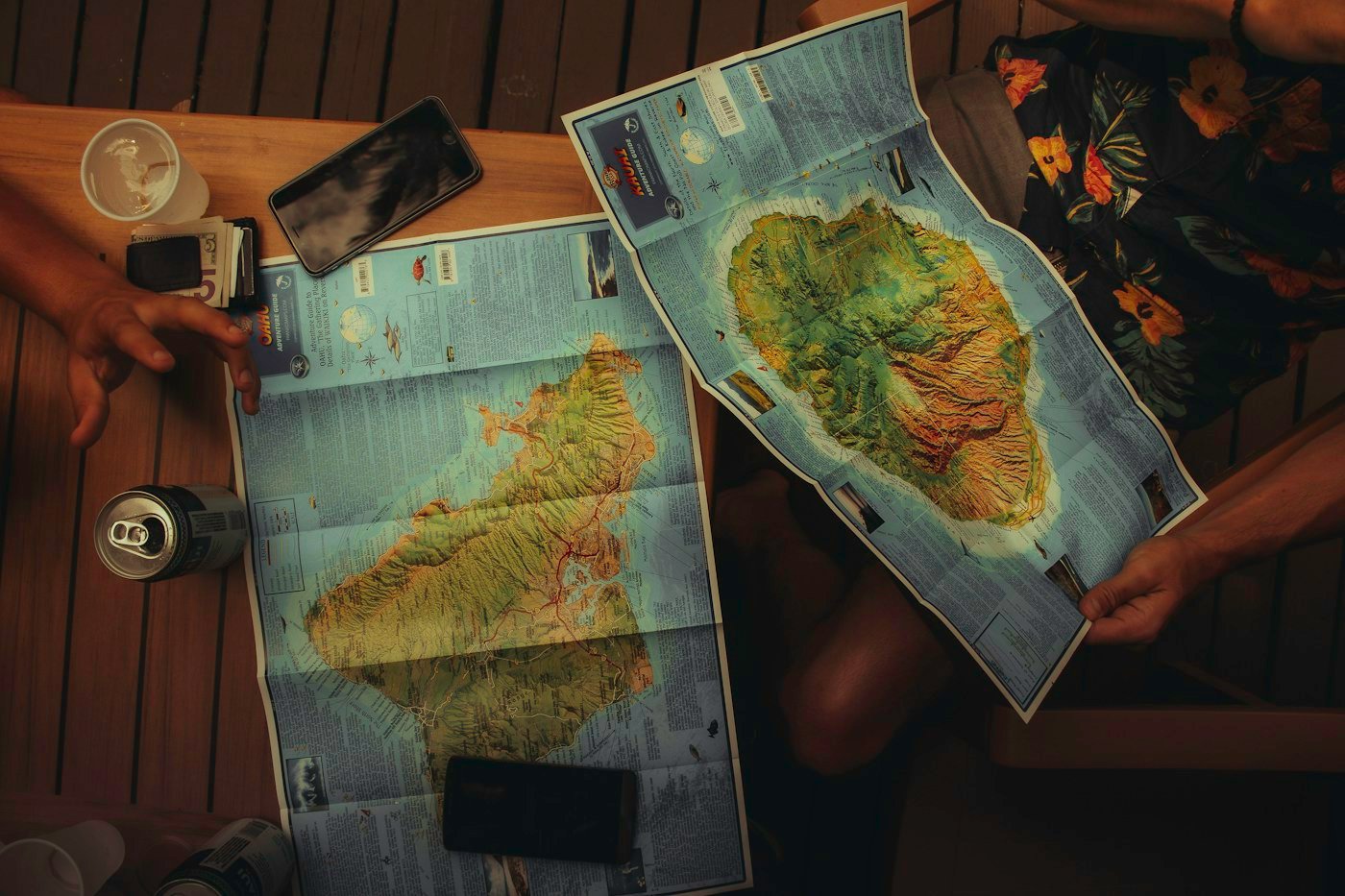 People reviewing maps before a trip